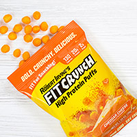 Request Fitcrunch® Cheddar Cheese High Protein Puffs For Free